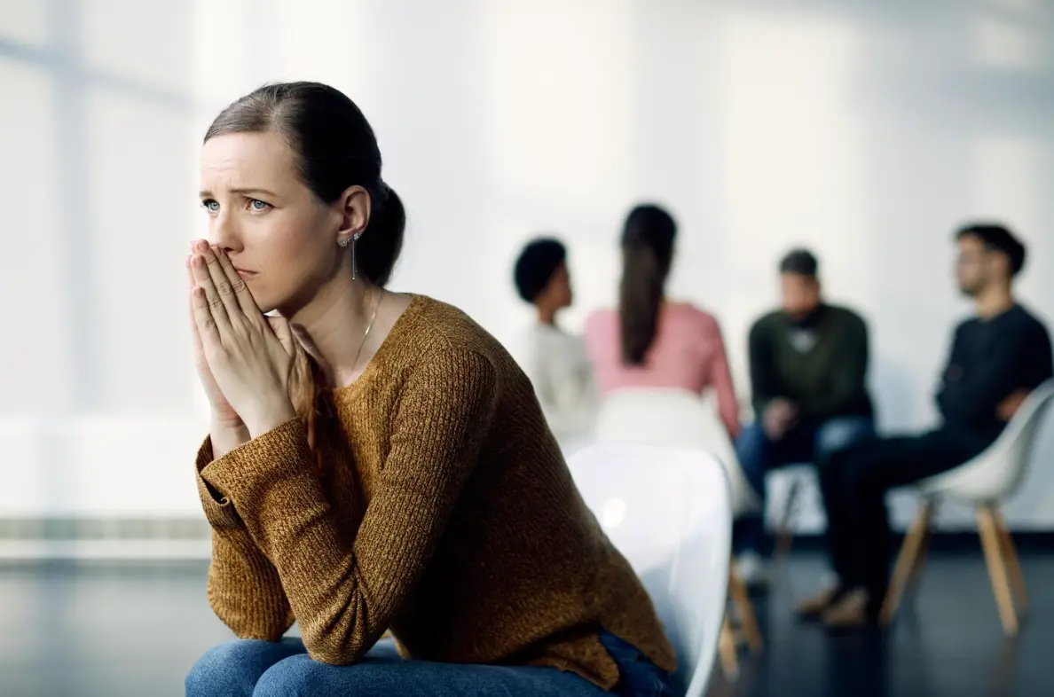 A woman looking overwhelmed.