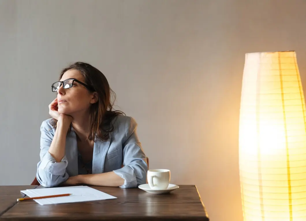 A woman reflecting on her life.