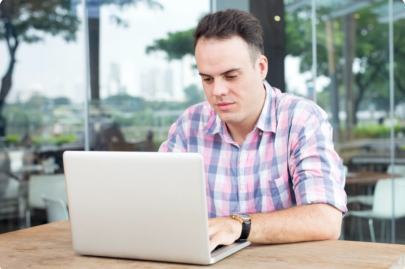 A man using his laptop.