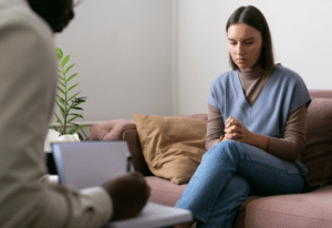 A woman speaking with a licensed therapist in CA.