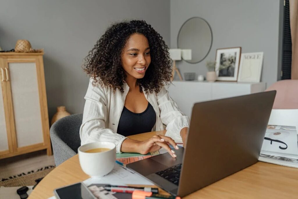 An image of a woman using her laptop