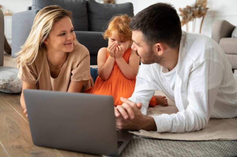 Blended family with a young child engaging in an online therapy session at home