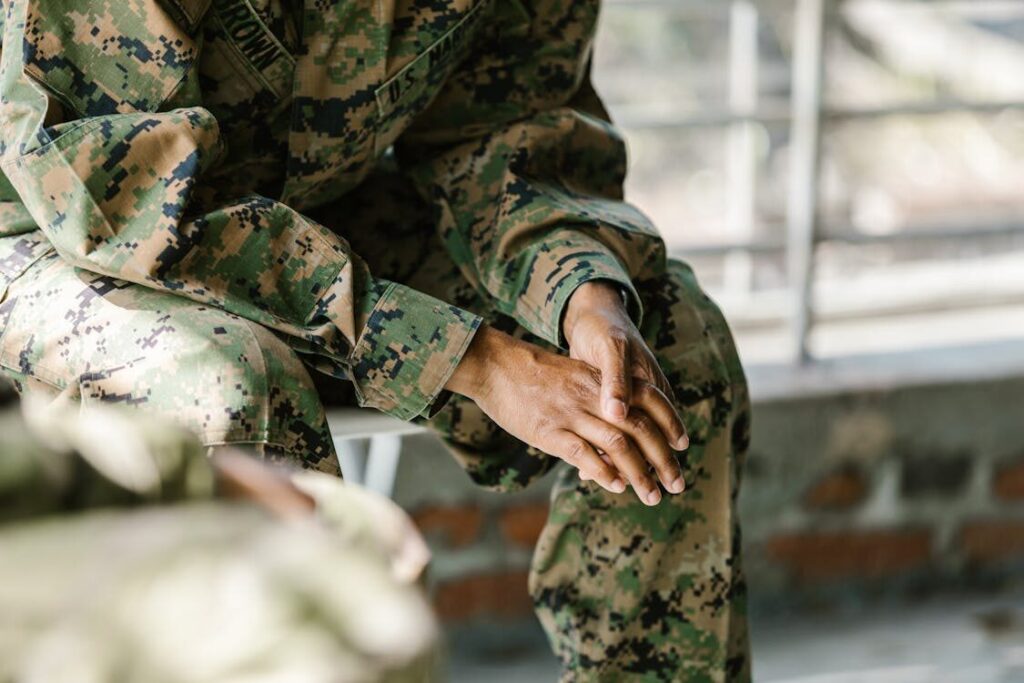 Military member sitting during a PTSD session in California