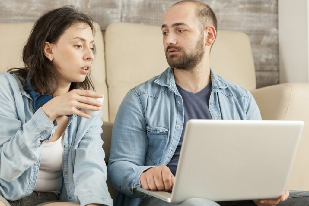 A couple sitting calmly together in their living room, having a focused conversation
