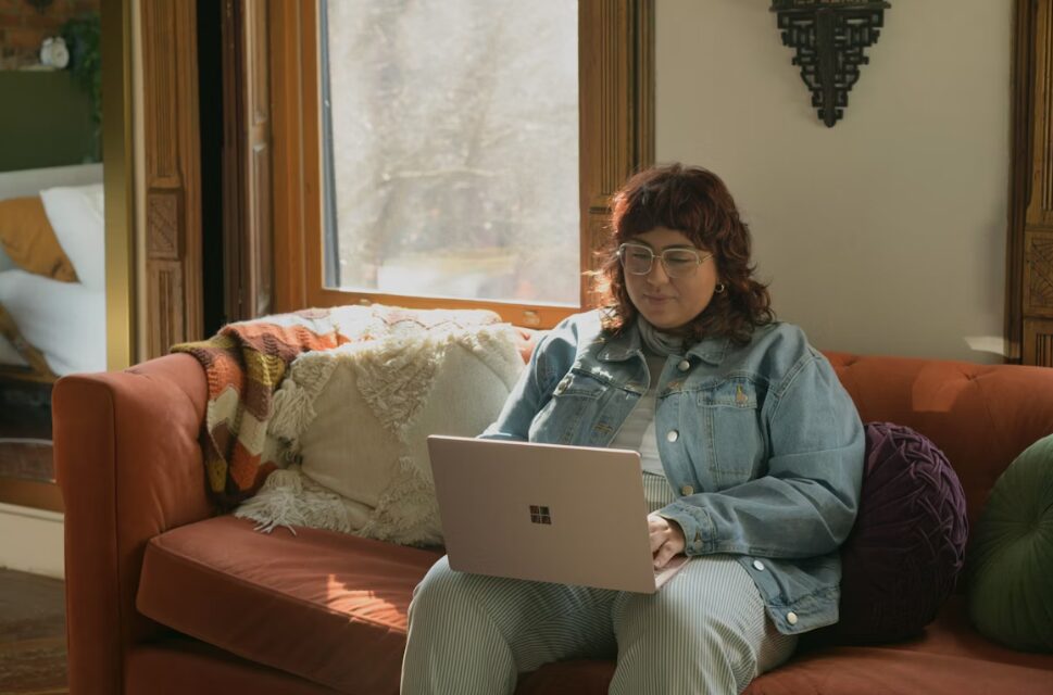 A young woman sitting on a couch at